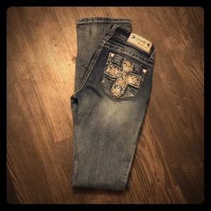 Jeweled pockets grace jeans sz. 25. Bootcut.